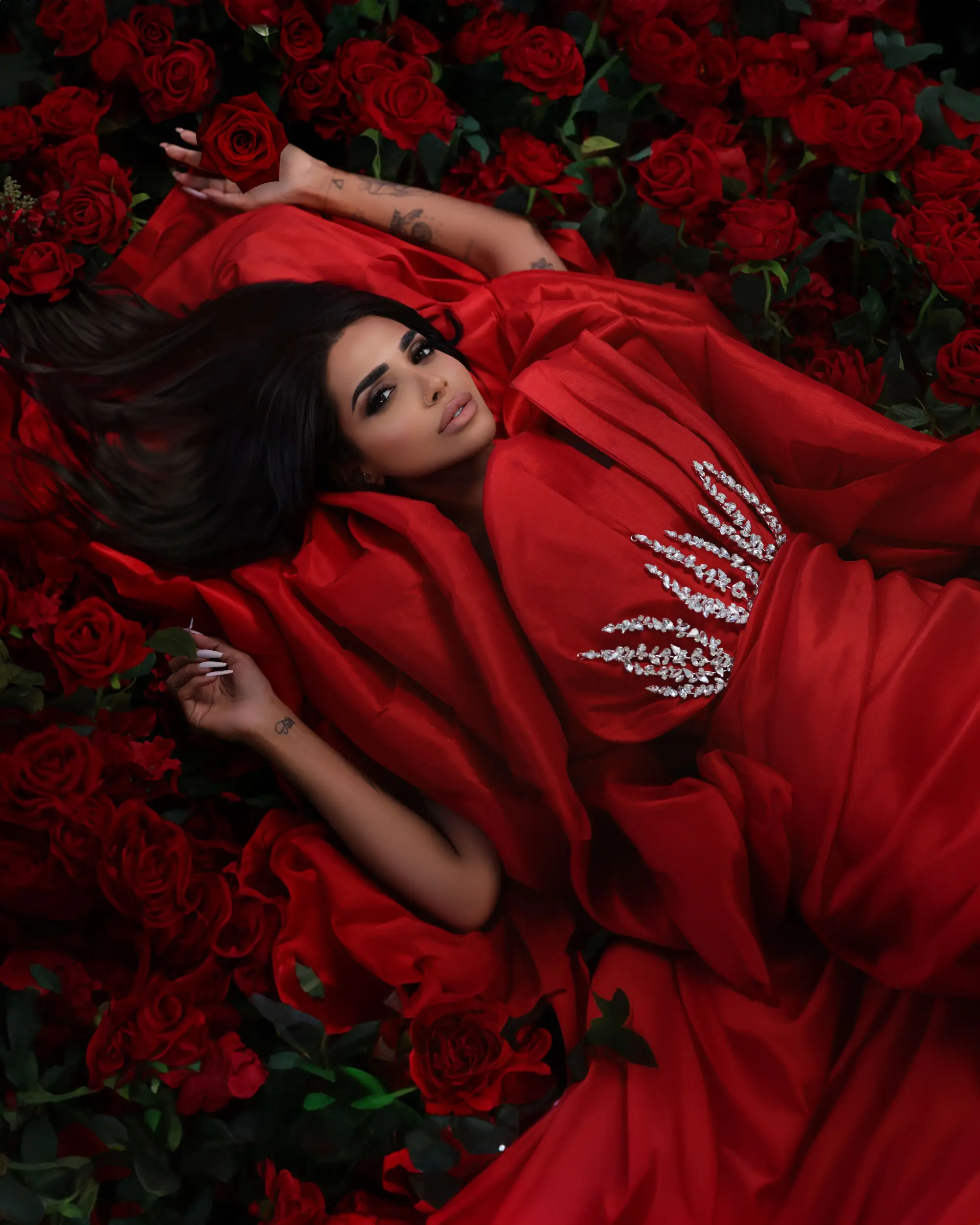 Sara Al Madani in a red editorial look